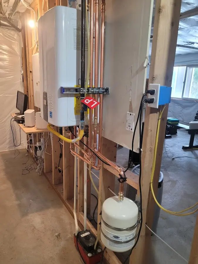 Licensed plumber repairing a kitchen sink in Absecon